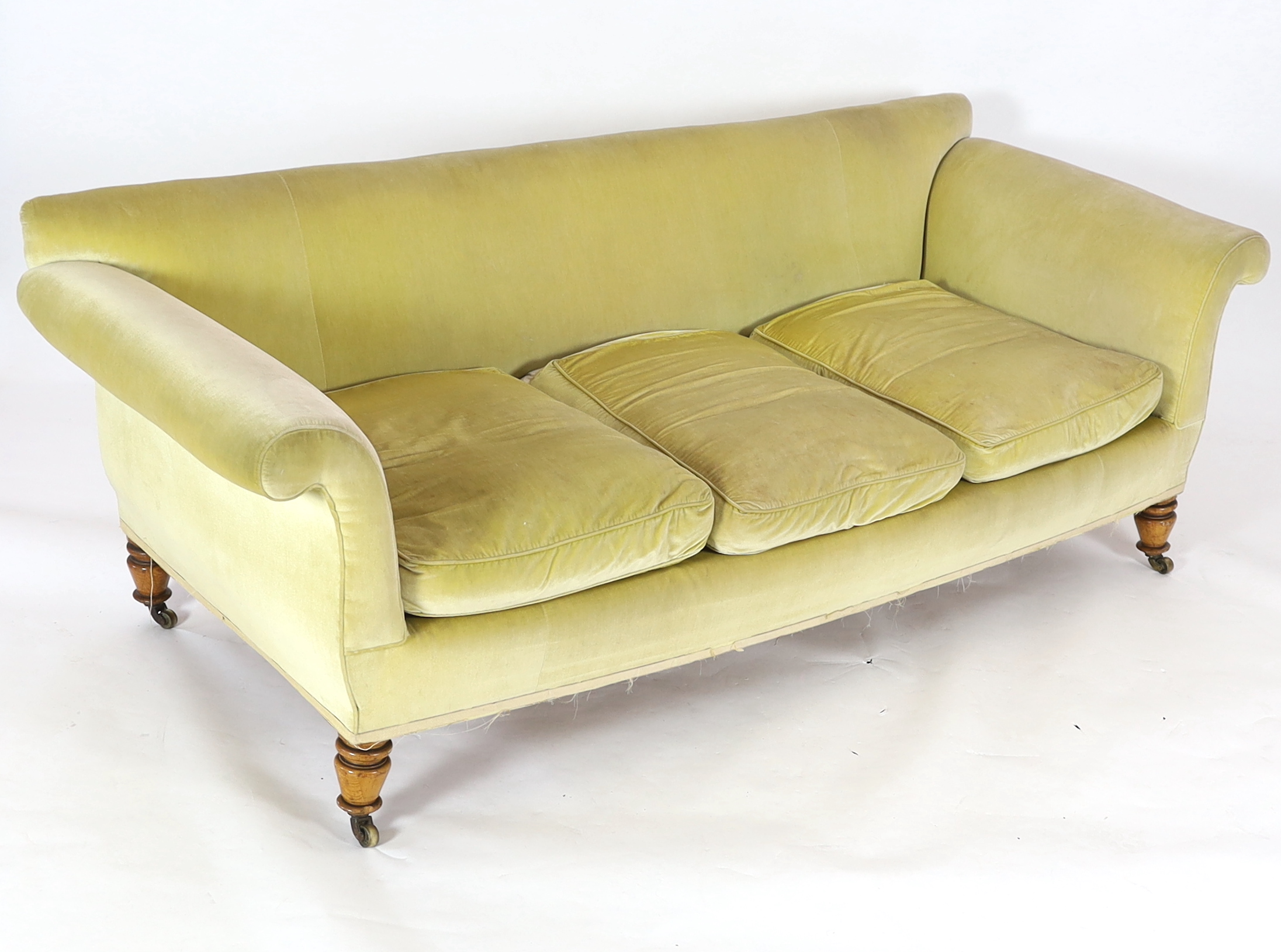 A large Victorian style sofa in the manner of Howard & Sons, 240cm wide, 92cm deep, 85cm high